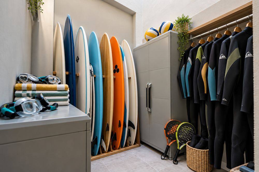Surfboards, wetsuits, towels, snorkel masks, balls and rackets ready for guests
