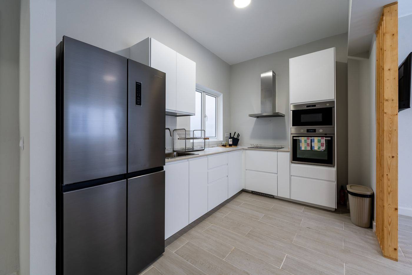 Kitchen with fridge, oven and hob